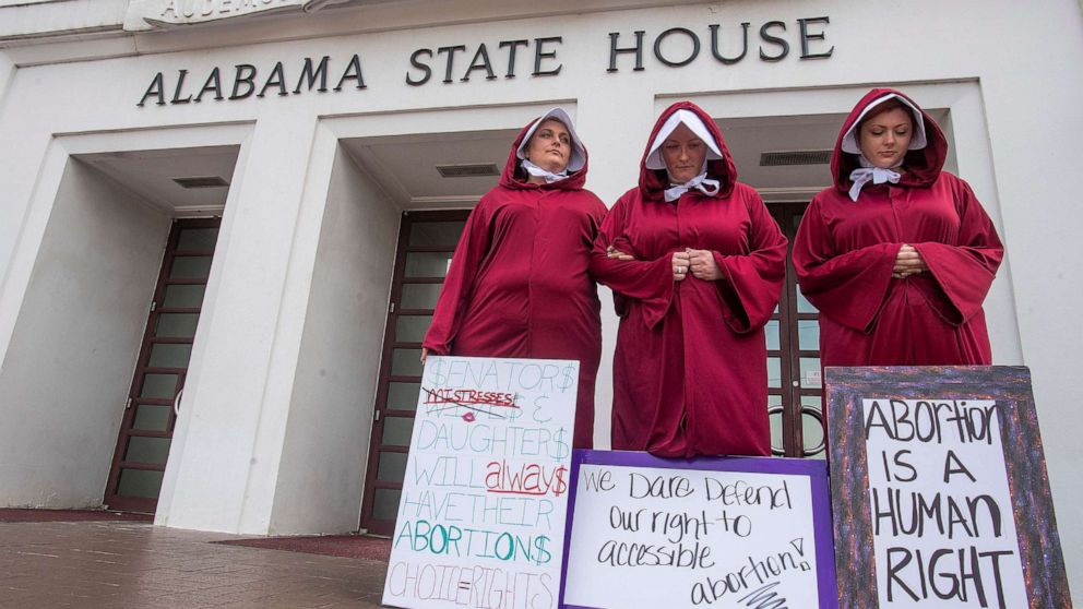 PHOTO: Abortion rights supporters dressed as handmaids take part in a protest against HB314, the abortion ban bill, at the Alabama Statehouse in Montgomery, Ala., April 17, 2019.