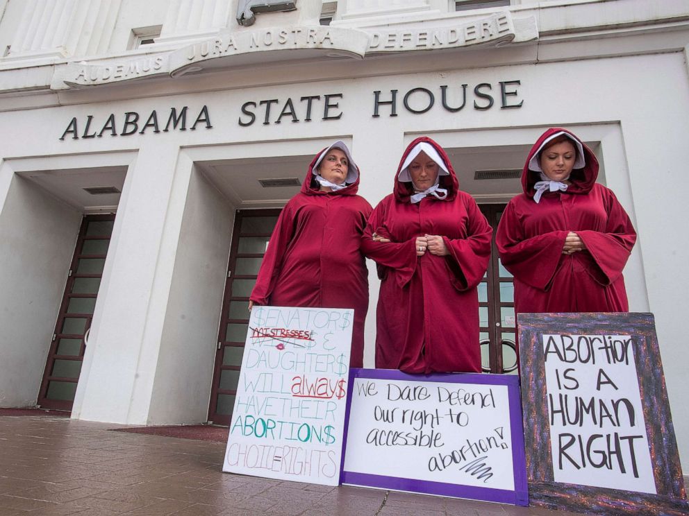 PHOTO: Abortion rights supporters dressed as handmaids take part in a protest against HB314, the abortion ban bill, at the Alabama Statehouse in Montgomery, Ala., April 17, 2019.