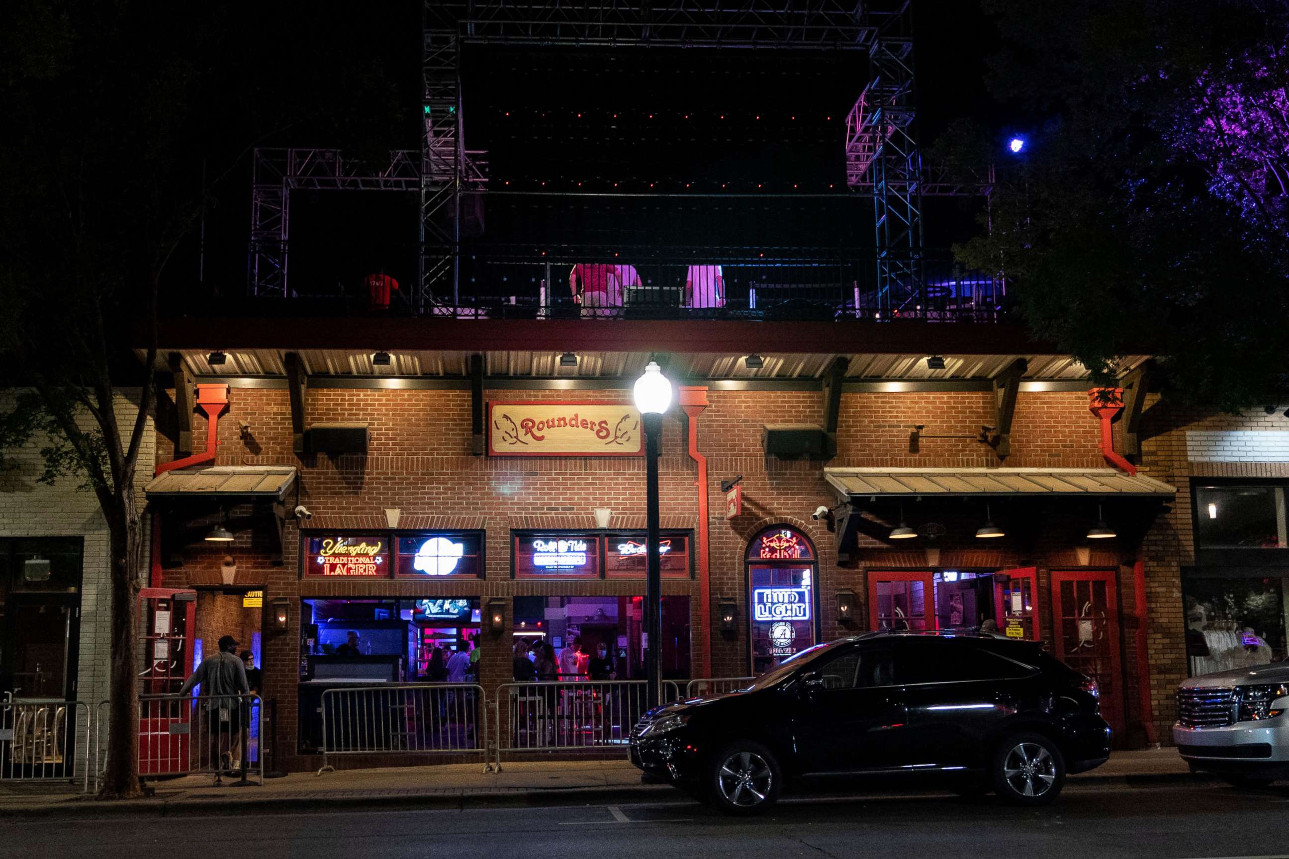PHOTO: Rounders Bar, on The Strip, the University of Alabama's bar scene, sees limited patronage as bars were restricted to half capacity and early closing hours, Aug. 15, 2020, in Tuscaloosa, Ala.