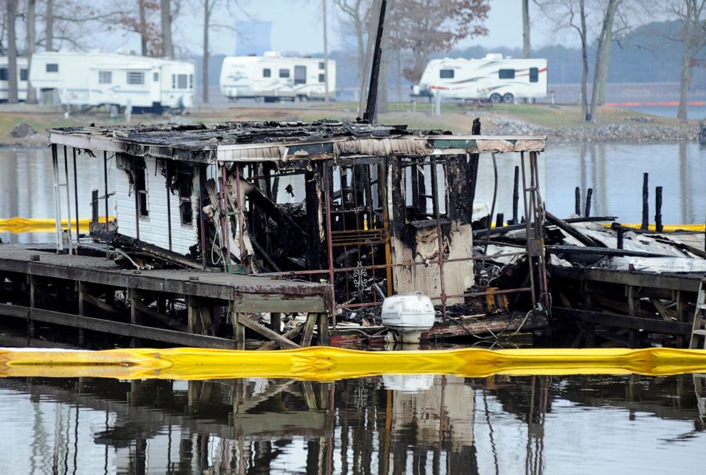 PHOTO: The charred remains of a boat are shown following a fatal fire at a Tennessee River marina in Scottsboro, Ala., on Jan. 27, 2020.
