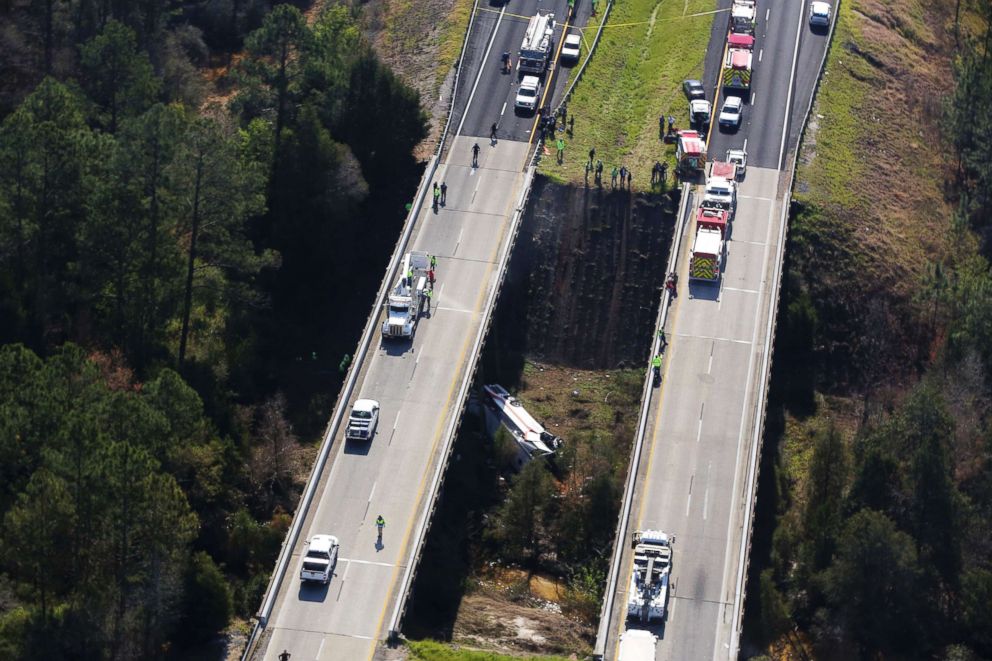 PHOTO: Rescue crews work at the scene of a deadly charter bus crash, March 13, 2018, in Loxley, Ala. The bus carrying Texas high school band members home from Disney World plunged into a ravine before dawn Tuesday. 