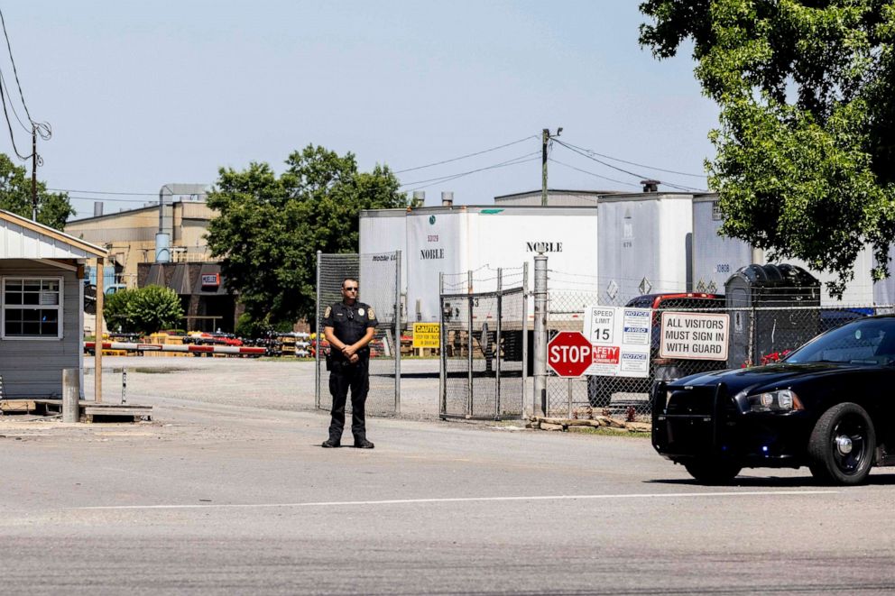 PHOTO: A police officer stands at the entrance to a Mueller Co. fire hydrant plant where police said multiple people were shot to death and others were wounded in Albertville, Ala., June 15, 2021.