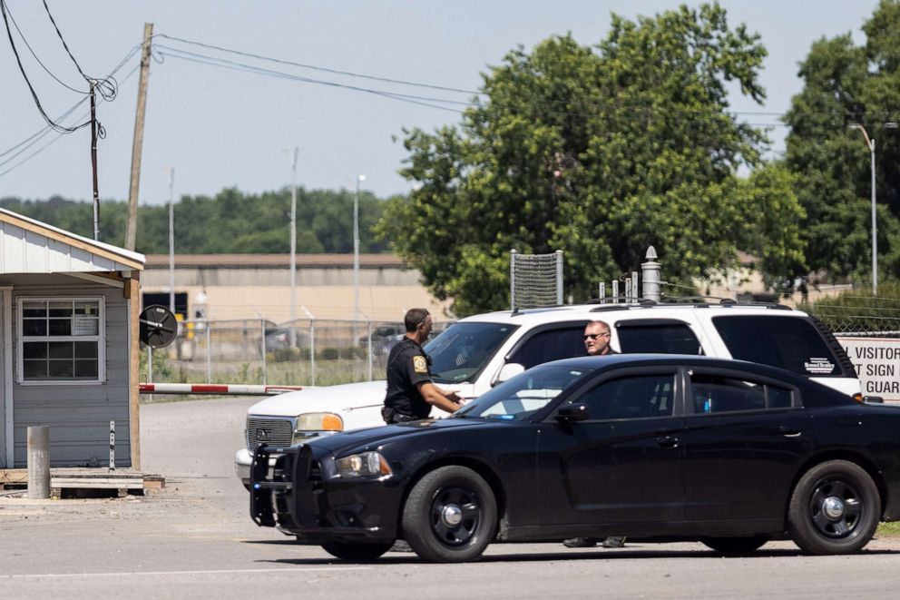 PHOTO: Police officers converse at the scene where multiple people were killed and others wounded in a shooting at a Mueller Co. fire hydrant plant, June 15, 2021, in Albertville, Ala.