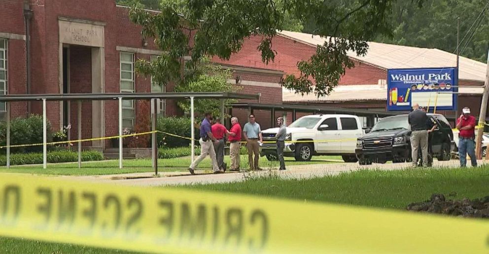 PHOTO: Authorities respond to the scene of the fatal shooting of a man by an officer outside Walnut Park Elementary School in Gadsden, Ala., June 9, 2022.