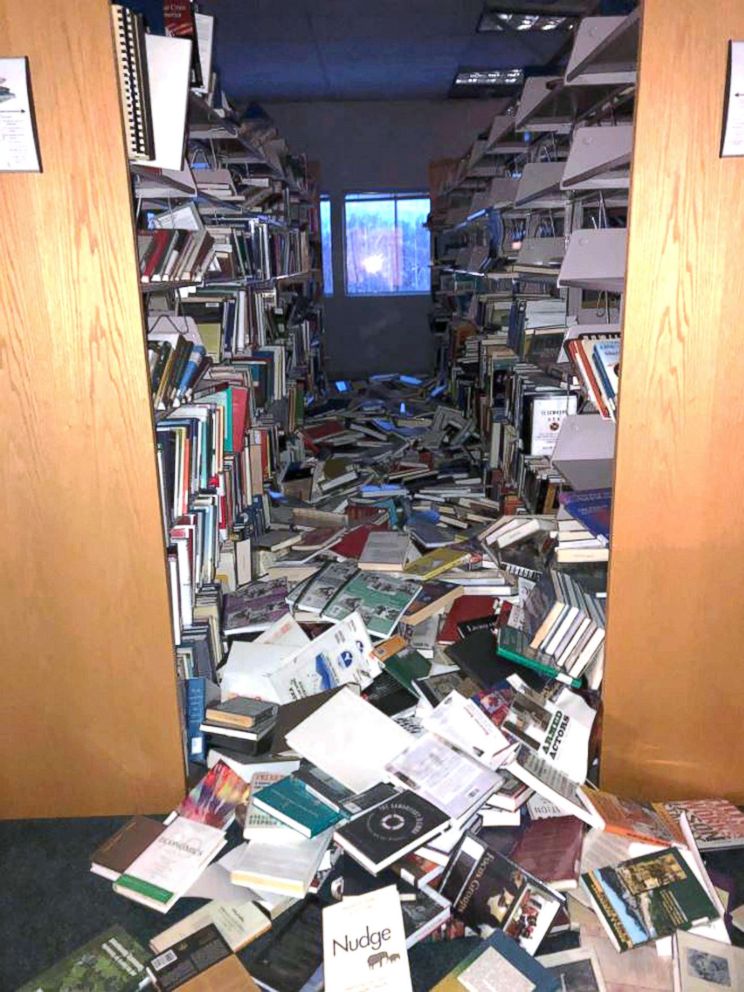 PHOTO: In this courtesy image books and ceiling tiles litter the floor at the The Mat-Su College library in Anchorage, Ala., Nov. 30, 2018.