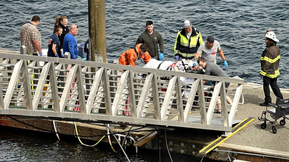 PHOTO: Emergency response crews transport an injured passenger to an ambulance at the George Inlet Lodge docks, Monday, May 13, 2019, in Ketchikan, Alaska.