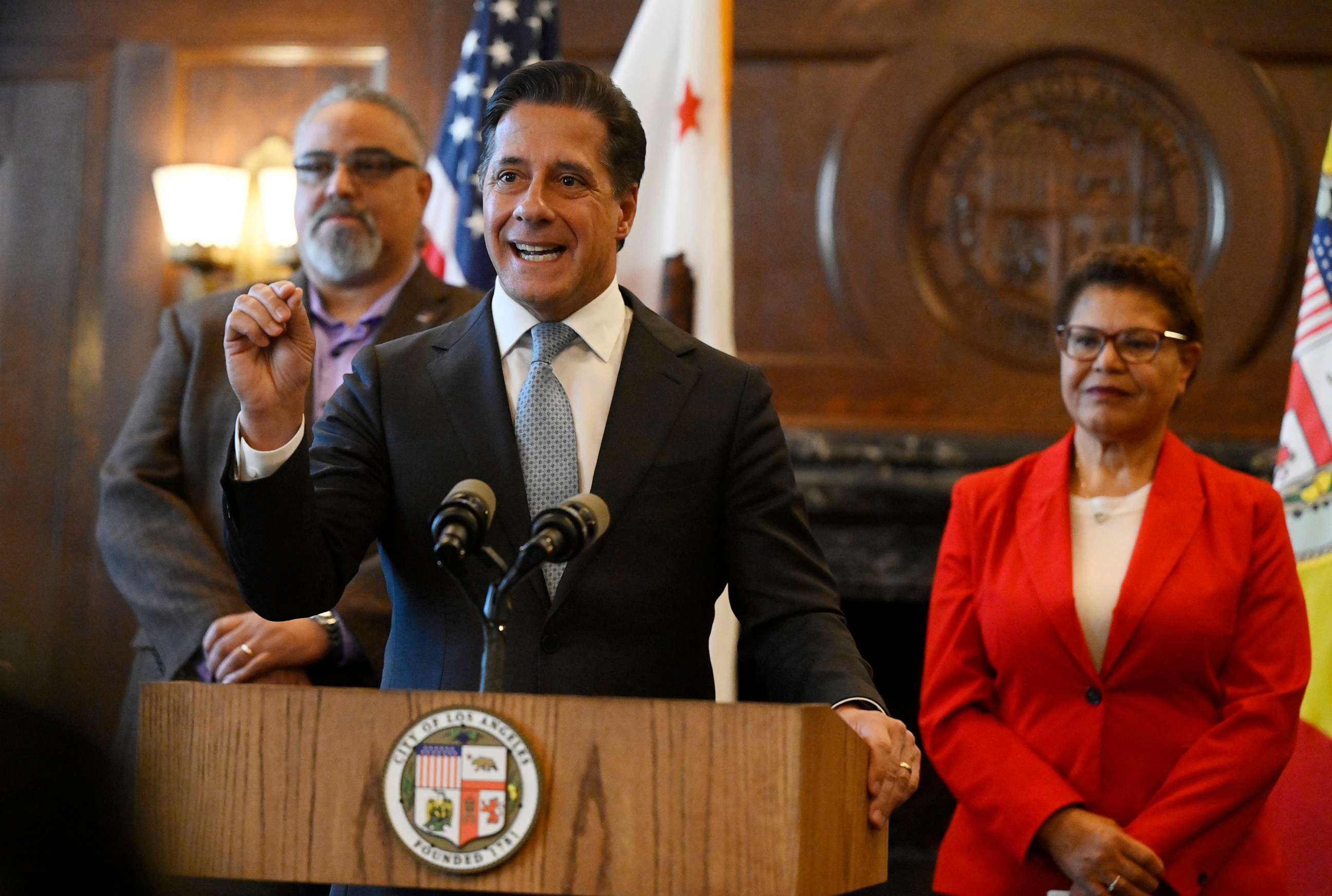 PHOTO: Alberto M. Carvalho, Superintendent of Los Angeles Unified School District, speaks as Max Arias, left, Executive Director of SEIU Local 99 and Mayor Karen Bass look on at City Hall, March 24, 2023, in Los Angeles.