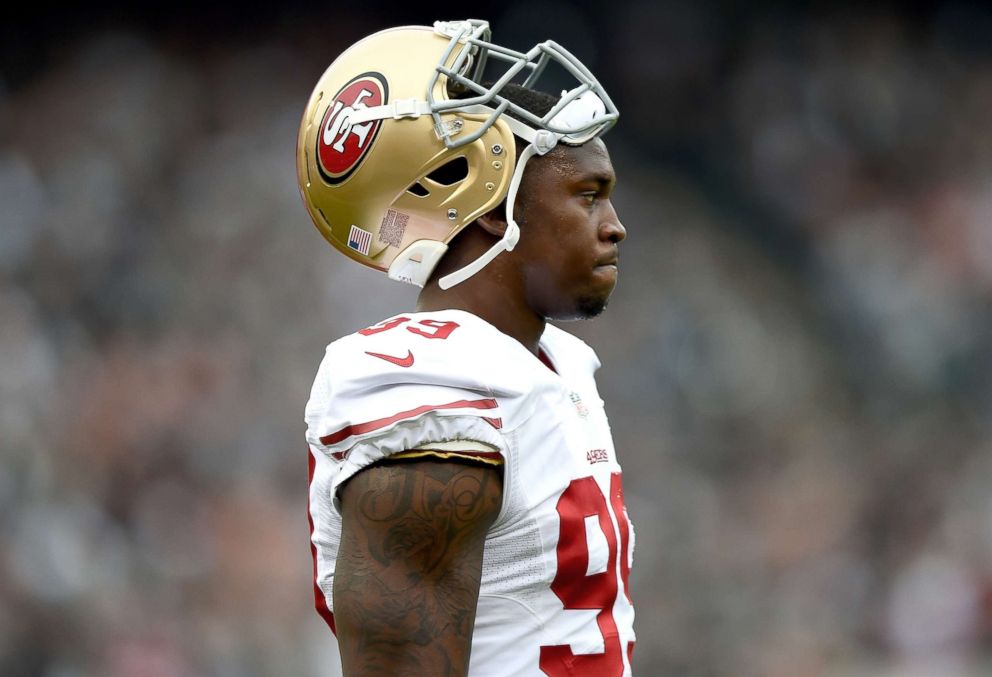 PHOTO: Aldon Smith of the San Francisco 49ers looks on during a timeout against the Oakland Raiders at O.co Coliseum, Dec. 7, 2014 in Oakland, Calif.