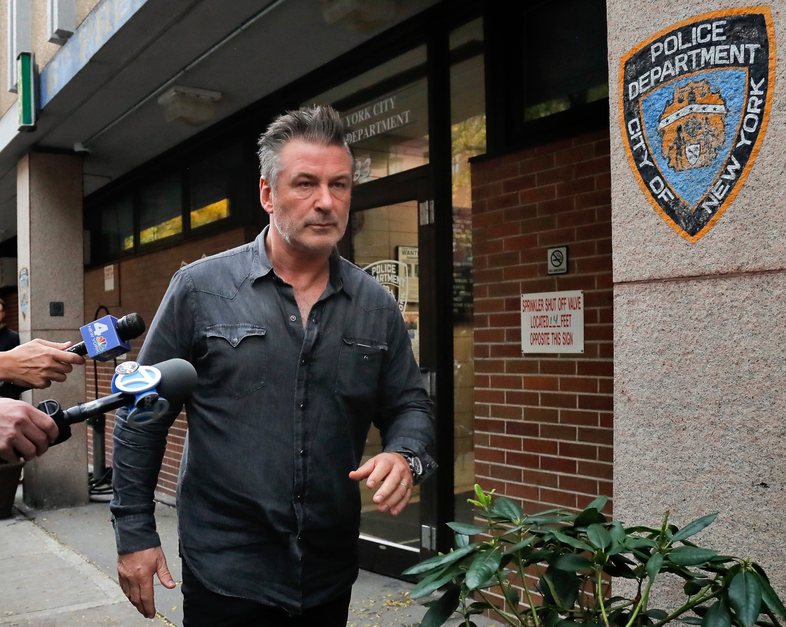PHOTO: In this Nov. 2, 2018, file photo, actor Alec Baldwin walks out of the New York Police Department's 10th Precinct, in New York, after he was arrested for allegedly punching a man during a dispute over a parking spot, authorities said.