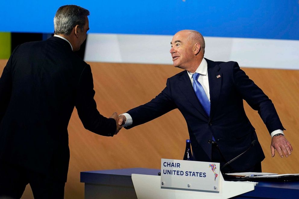 PHOTO: Homeland Security Secretary Alejandro Mayorkas, right, shakes hands with Dominican Republic President Luis Abinader during a plenary session at the Summit of the Americas, June 10, 2022, in Los Angeles.