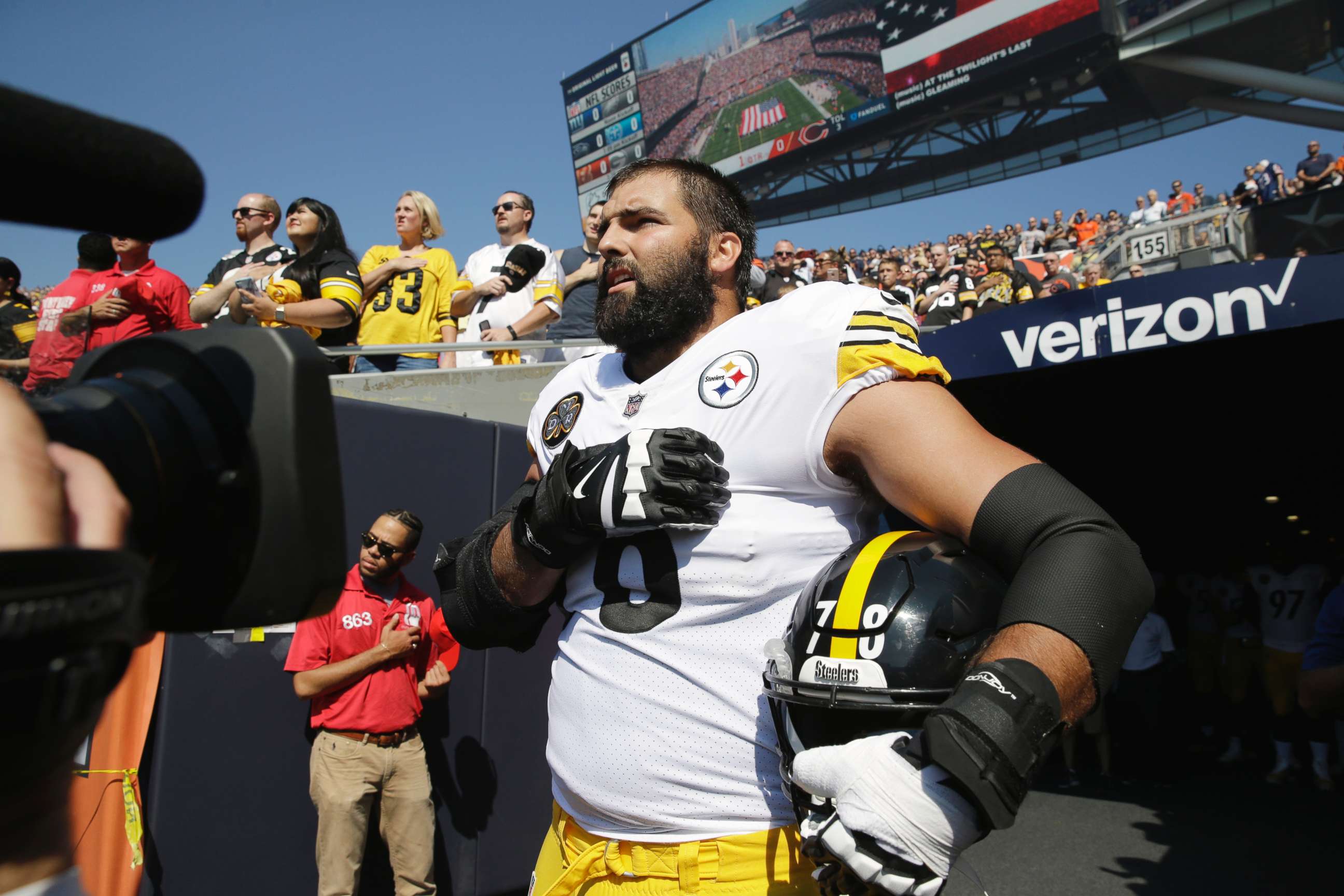 PHOTO: Pittsburgh Steelers offensive tackle and former Army Ranger Alejandro Villanueva stands outside the tunnel alone during the national anthem before an NFL football game against the Chicago Bears, Sept. 24, 2017, in Chicago.