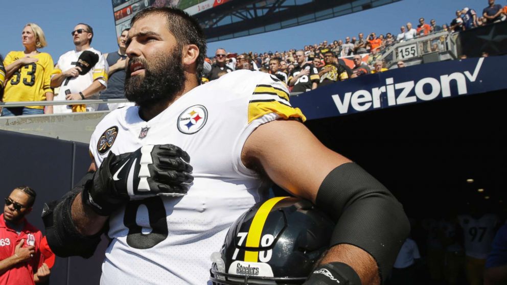 PHOTO: Pittsburgh Steelers offensive tackle and former Army Ranger Alejandro Villanueva stands outside the tunnel alone during the national anthem before an NFL football game against the Chicago Bears, Sept. 24, 2017, in Chicago.