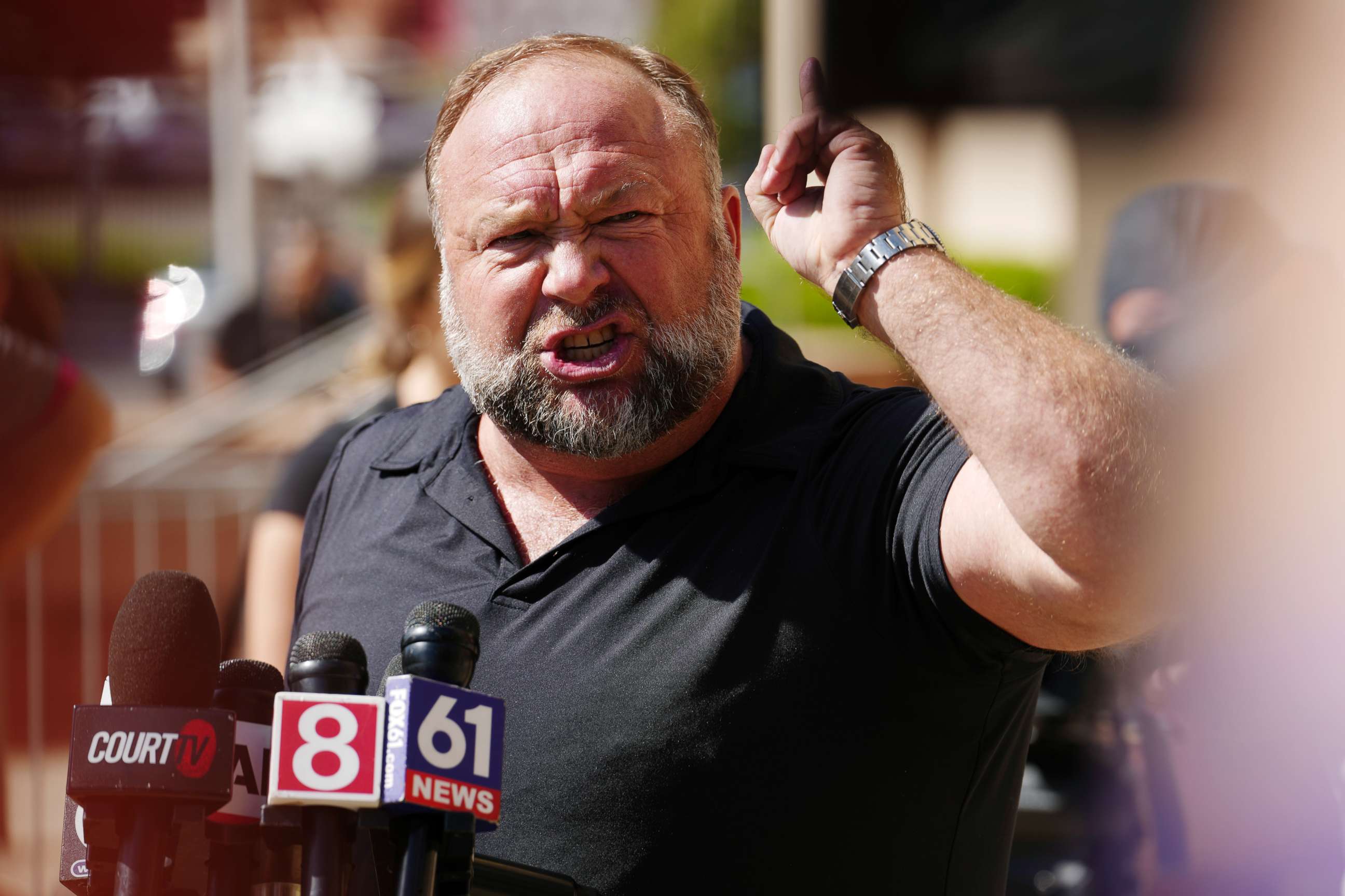 PHOTO: InfoWars founder Alex Jones speaks to the media outside Waterbury Superior Court during his trial on September 21, 2022 in Waterbury, Connecticut.