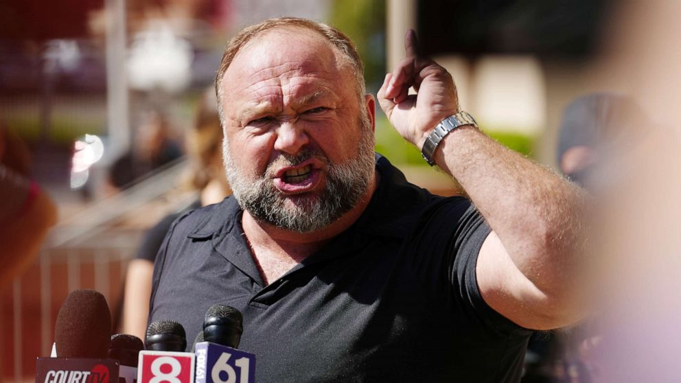 PHOTO: InfoWars founder Alex Jones speaks to the media outside Waterbury Superior Court during his trial on September 21, 2022 in Waterbury, Connecticut.