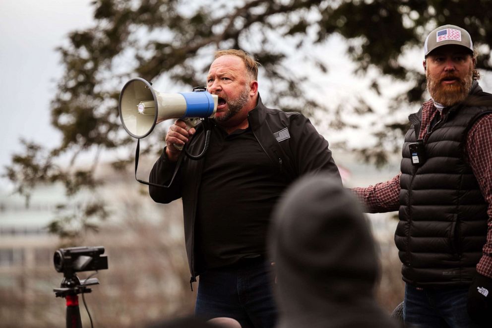 PHOTO: In this Jan. 6, 2021, file photo, Alex Jones, the founder of right-wing media group Infowars, addresses a crowd of pro-Trump protesters after they storm the grounds of the Capitol Building in Washington, D.