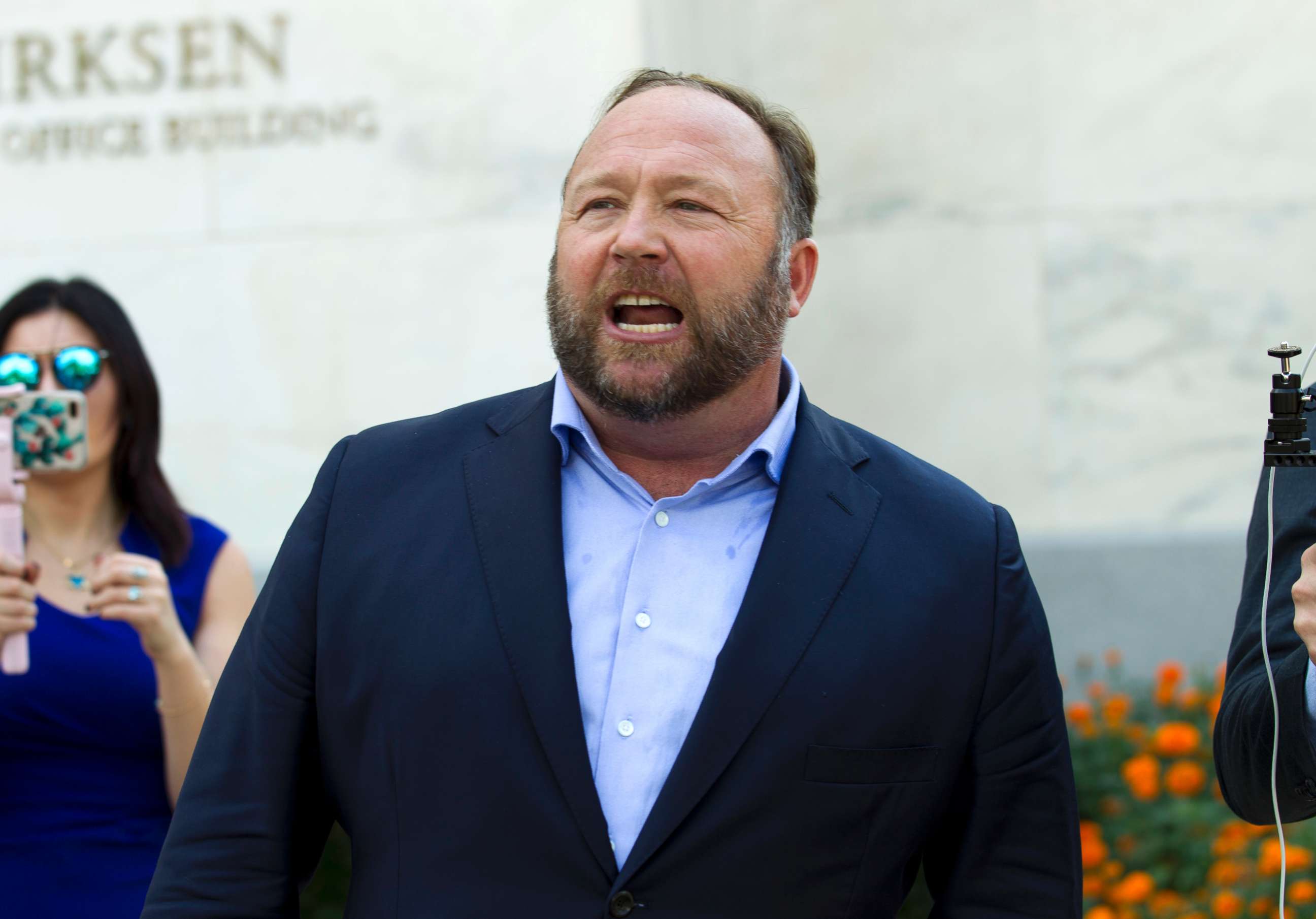 PHOTO: Conspiracy theorist Alex Jones speaks outside after listening to a Senate Intelligence Committee meeting on Capitol Hill, Sept. 5, 2018, in Washington.
