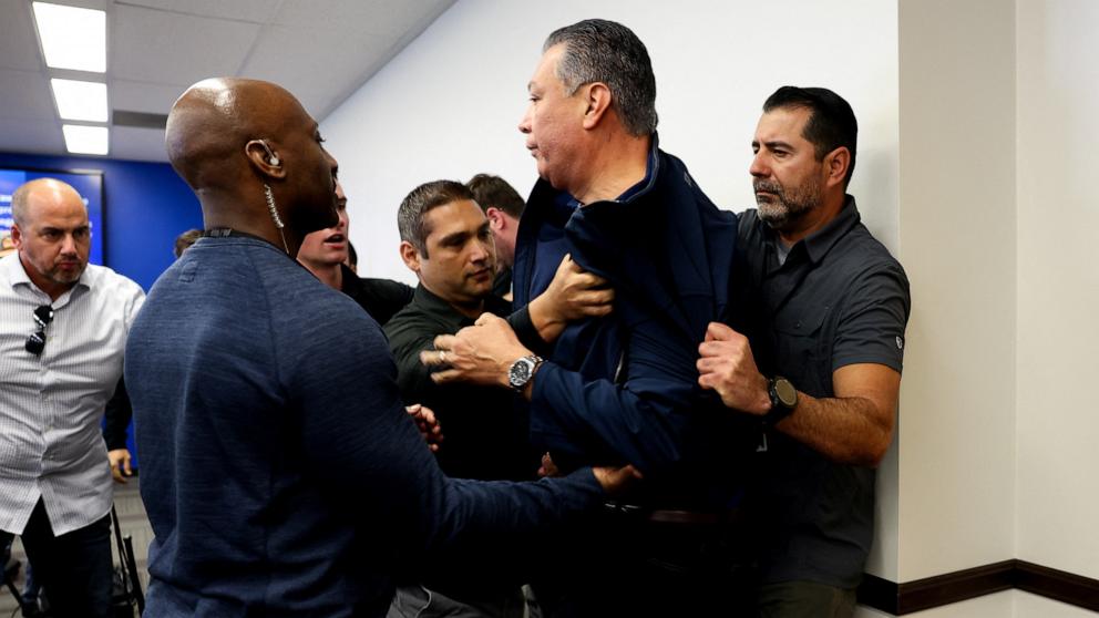 PHOTO: Sen. Alex Padilla, Democrat from California,who interrupted a press conference held by U.S. Secretary of Homeland Security Kristi Noem, is removed from the venue, in Los Angeles, June 12, 2025.