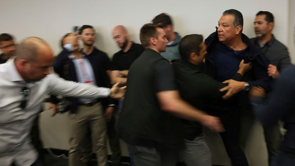 PHOTO: Sen. Alex Padilla, Democrat from California, who interrupted a press conference held by U.S. Secretary of Homeland Security Kristi Noem, is removed from the venue, in Los Angeles, June 12, 2025.