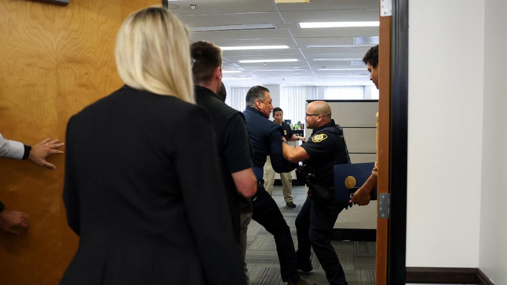 PHOTO: Sen. Alex Padilla is detained and removed from the venue after interrupting the press conference held by U.S. Secretary of Homeland Security Kristi Noem in Los Angeles, June 12, 2025. 