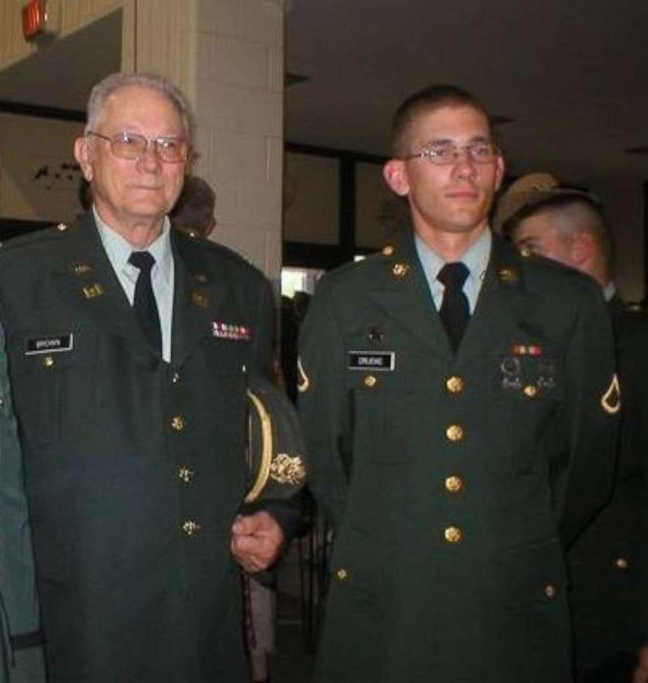 PHOTO: Alexander Drueke is shown in uniform standing next to his grandfather, in 2003.