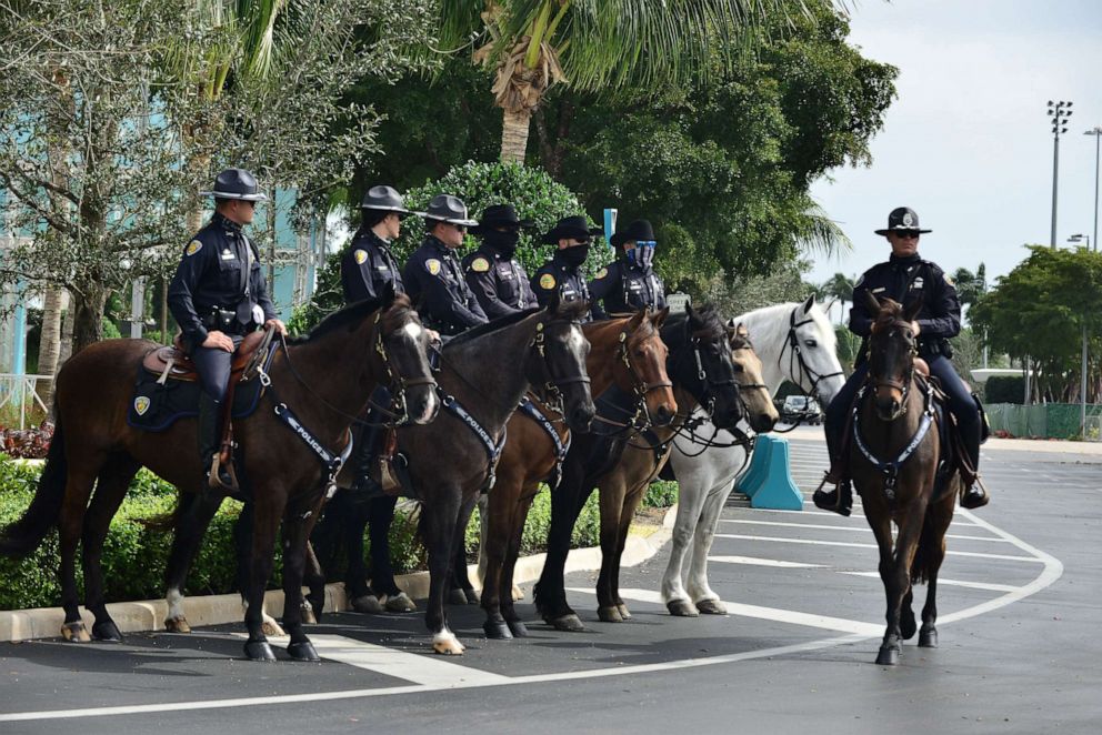 PHOTO: Mounted police officers stand on guard for the memorial service to honor slain FBI agent Dan Alfin at the Hard Rock Stadium, Feb. 7, 2021, in Miami Gardens, Fla.