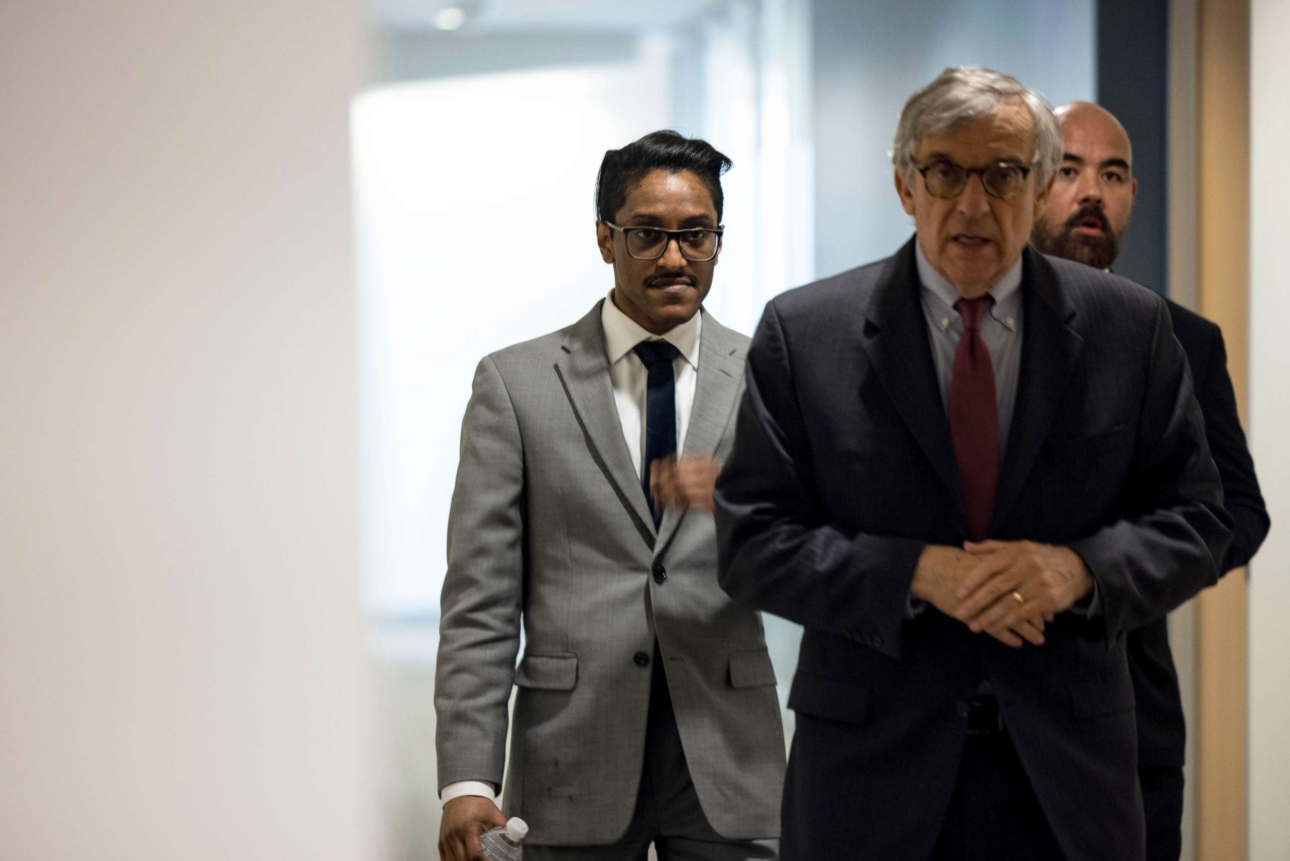 PHOTO: Stop the Steal organizer Ali Alexander, left, returns to a conference room for a deposition meeting on Capitol Hill with the House select committee investigating the January 6th attack, Dec. 9, 2021 in Washington, DC.