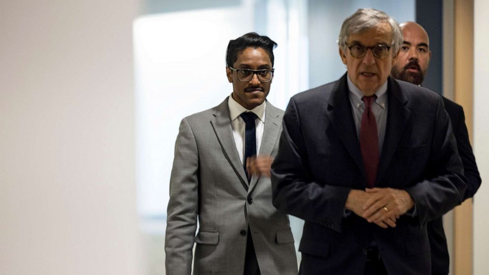 PHOTO: Stop the Steal organizer Ali Alexander, left, returns to a conference room for a deposition meeting on Capitol Hill with the House select committee investigating the January 6th attack, Dec. 9, 2021 in Washington, DC.