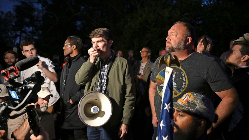 PHOTO: Nick Fuentes, Alex Jones and Ali Alexander participate in a "Stop the Steal" rally at the Governor's Mansion in Atlanta, calling on Governor Kemp to help President Trump as the state finishes the Presidential election recount on Nov. 19, 2020.