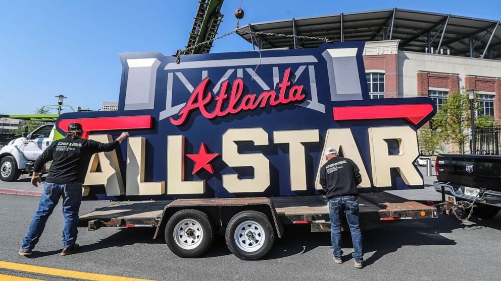 PHOTO: Workers load an All-Star sign onto a trailer after it was removed from Truist Park in Atlanta, April 6, 2021, after Major League Baseball pulled the game from Atlanta over objections to sweeping changes to Georgia's voting laws.