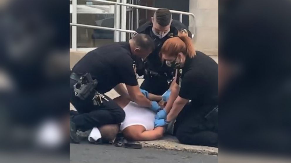PHOTO: A still from a video shows officers in Allentown, Pennsylvania, restraining a suspect outside St Luke's Sacred Heart Hospital on July 11, 2020. 