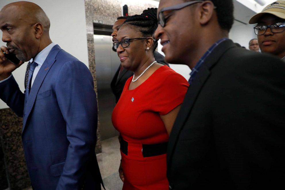 PHOTO: Daryl Washington, left, Allison Jean, center, the mother of victim Botham Jean, and others arrive back at Frank Crowley Courts Building for the sentencing phase in the trial of fired Dallas police officer Amber Guyger, Oct. 1, 2019 in Dallas.