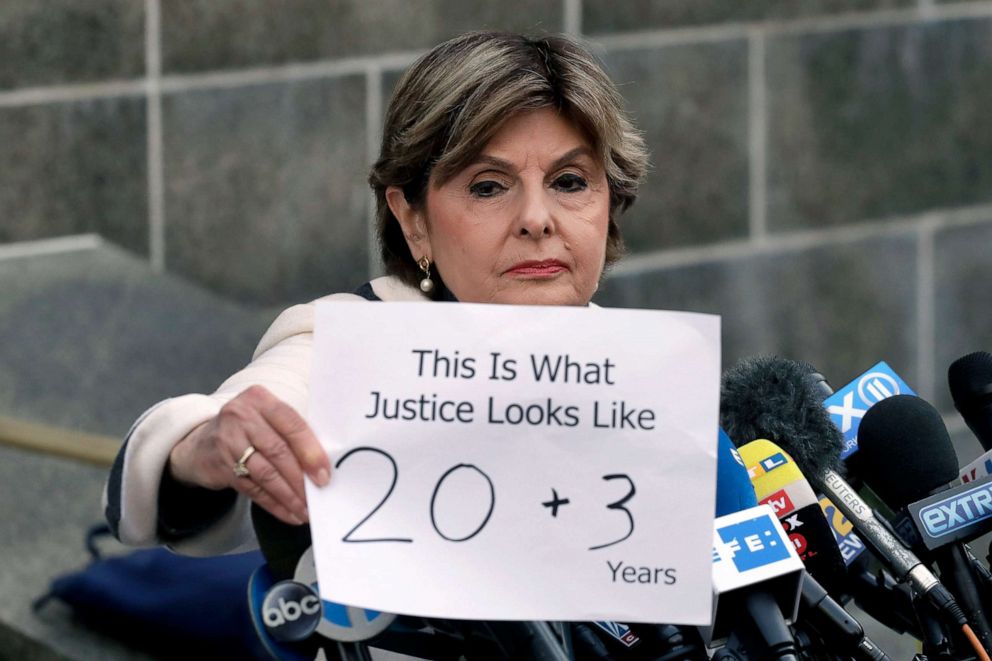 PHOTO: Attorney Gloria Allred holds a sign as she meets the press after Harvey Weinstein's sentencing, in New York, March 11, 2020. Weinstein was sentenced to 23 years in prison for rape and sexual assault.
