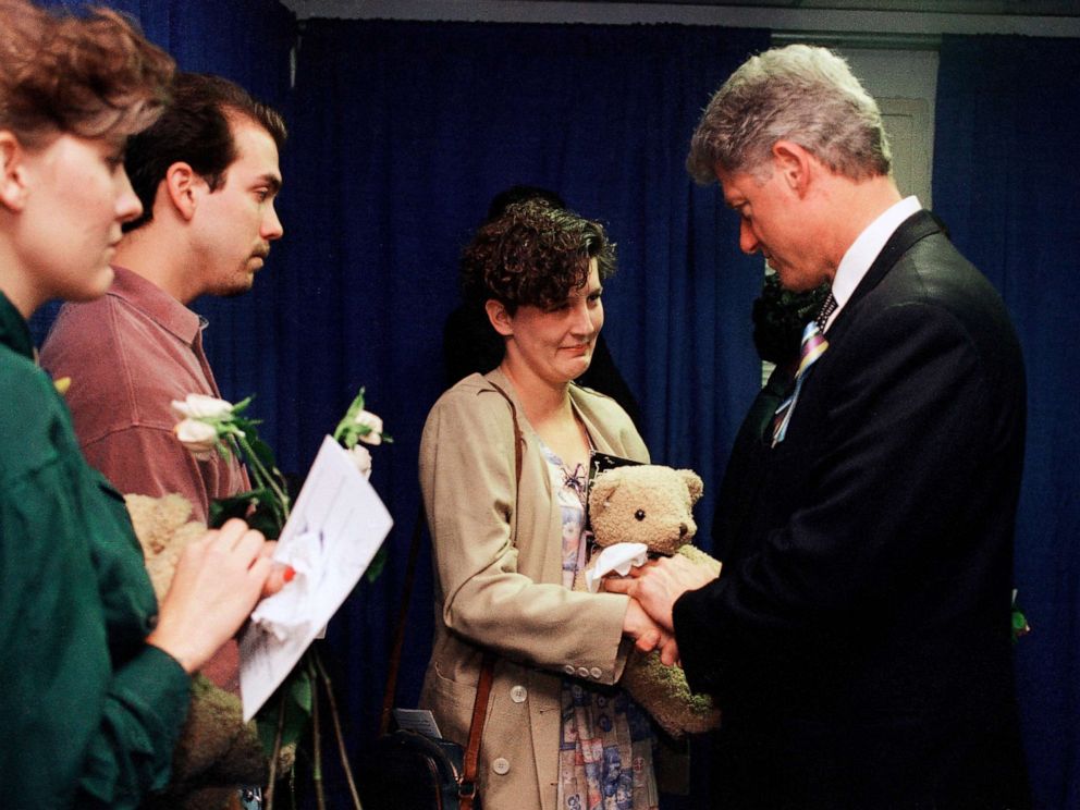 PHOTO: In this Sunday, April 23, 1995 file photo, Aren Almon of Oklahoma City, clutches a teddy bear as she is greeted by President Bill Clinton after a prayer service for the victims of a deadly car bomb attack in Oklahoma City. 