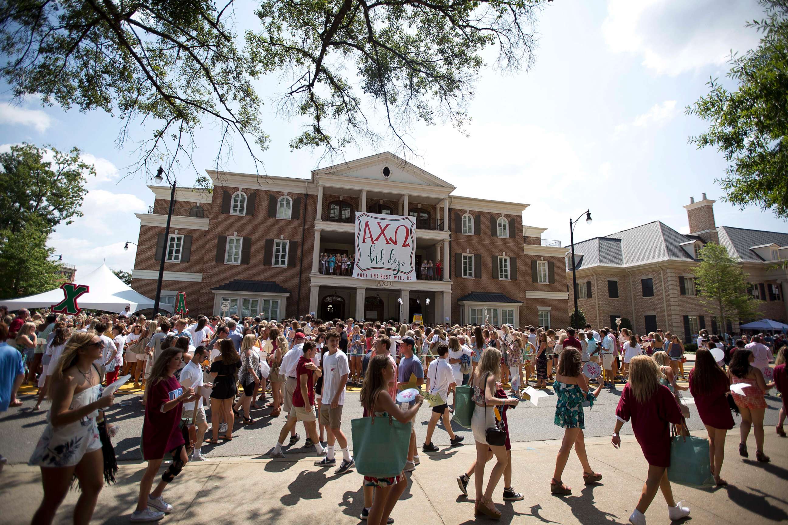 PHOTO: College students gather outside of the Alpha Chi Omega house during the University of Alabama sorority recruitment Bid Day, Saturday, Aug. 19, 2017, in Tuscaloosa, Ala. 