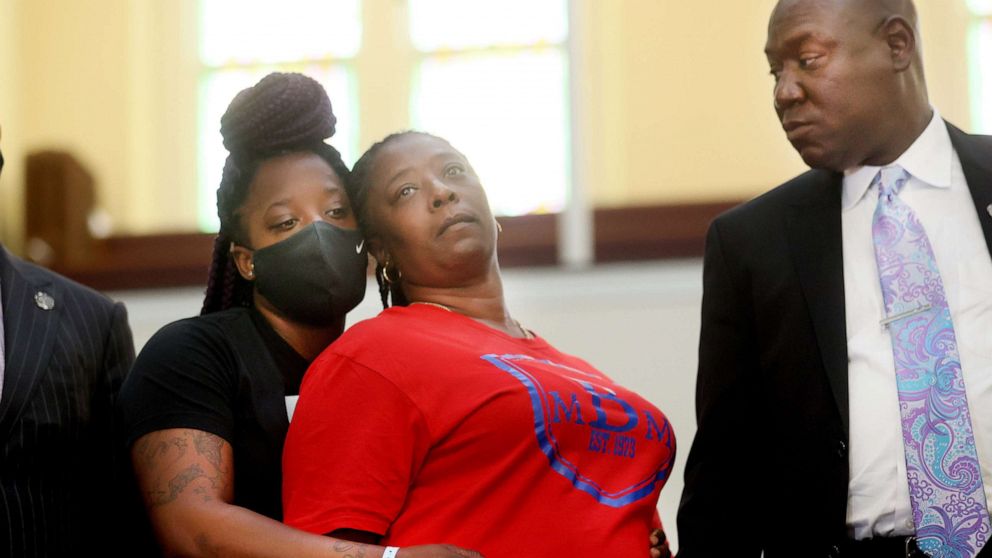 PHOTO: Tasheta Motley is held by her daughter Tammy Sykes and holds hands with civil rights attorney Benjamin Crump before a press conference, Aug. 10, 2021, at Mt. Olive CME Church about the shooting death of her brother, Alvin Motley, in Memphis, Tenn.