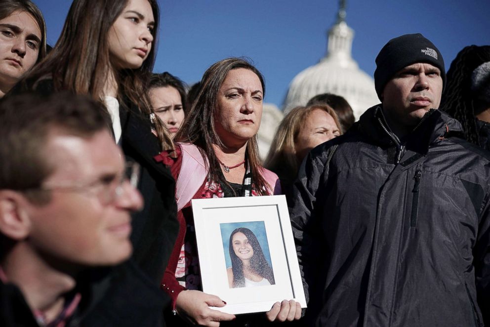 PHOTO: Lori Alhadeff and her husband Ilan Alhadeff right, hold a picture of their daughter Alyssa Alhadeff, a Marjory Stoneman Douglas High School shooting victim, during a news conference on gun control March 23, 2018 on Capitol Hill in Washington.