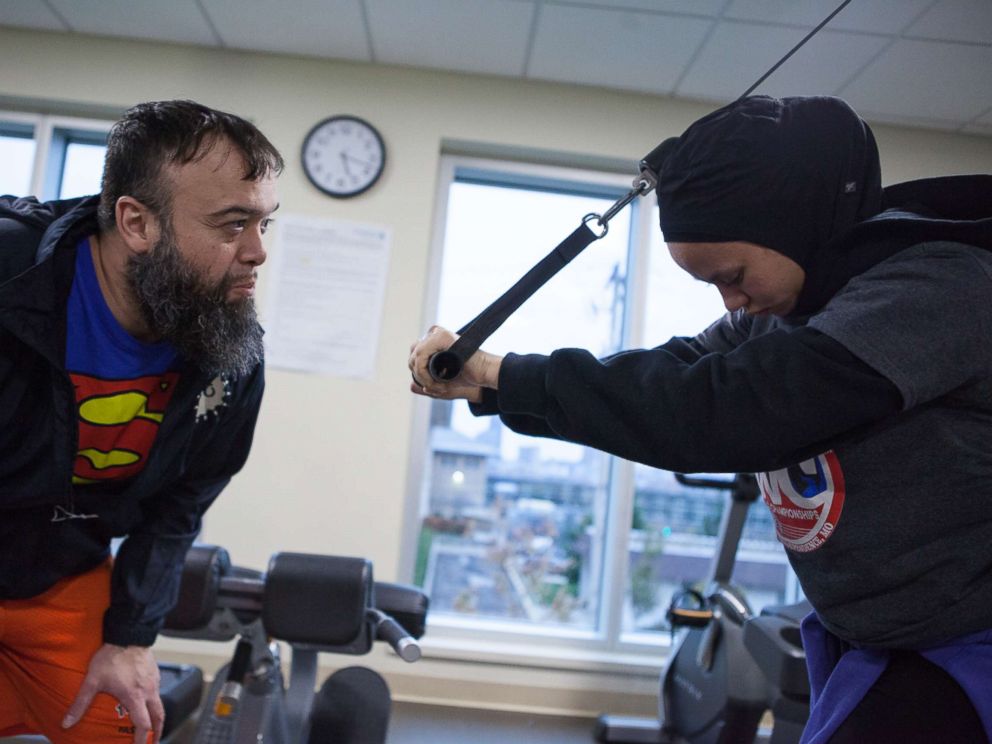 PHOTO: Zafars father, Mohammed, helps her train.