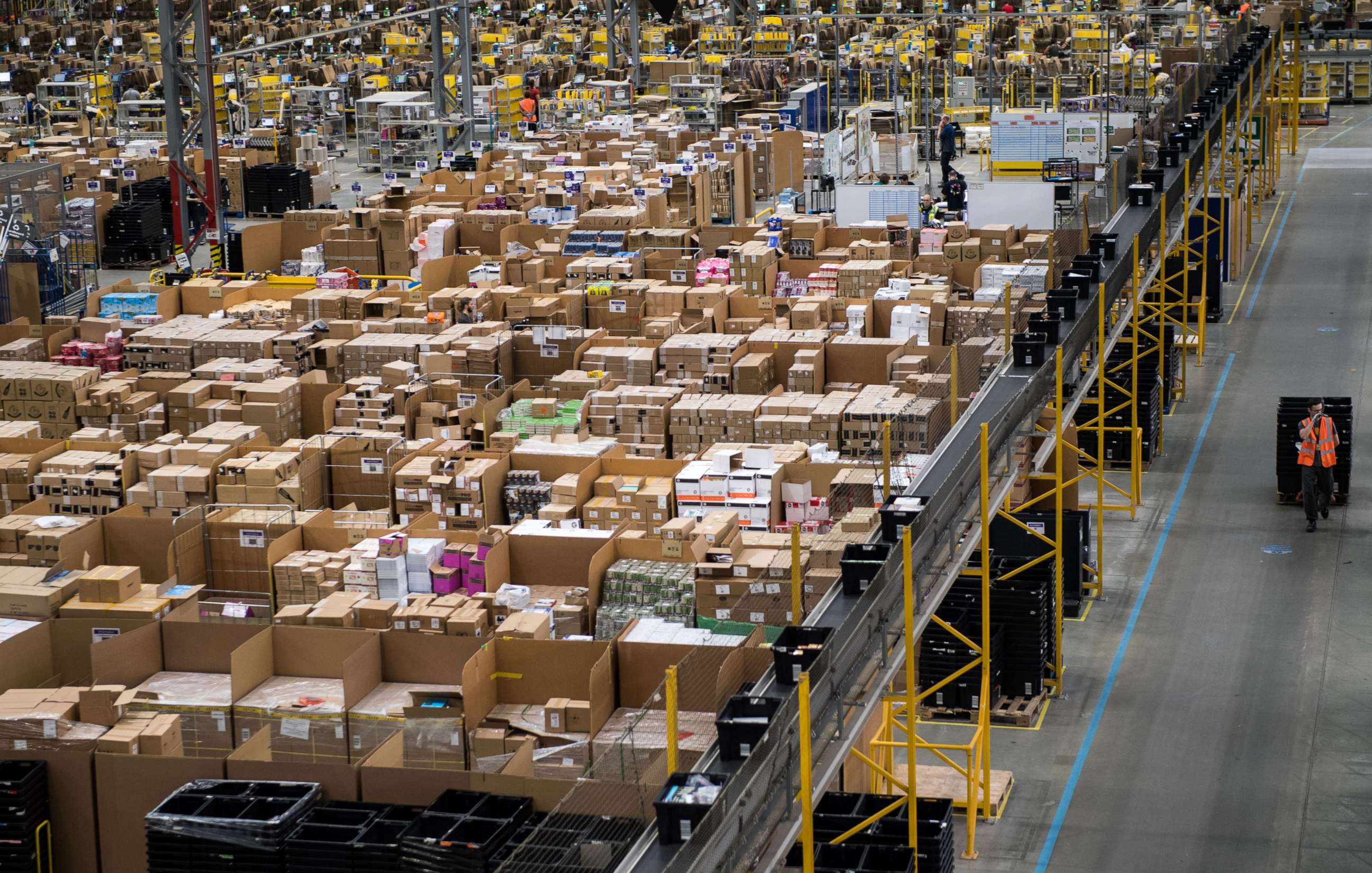 PHOTO: Workers prepare customer orders for dispatch as they work around goods stored inside an Amazon.co.uk fulfillment centre in Peterborough, central England, on Nov. 15, 2017.