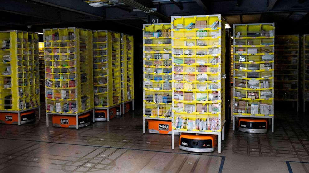 PHOTO: Hundreds of lawnmower-sized robots that move around shelving units in a closed field are seen during a tour of Amazon's Fulfillment Center, Sept. 21, 2018, in Kent, Wash.
