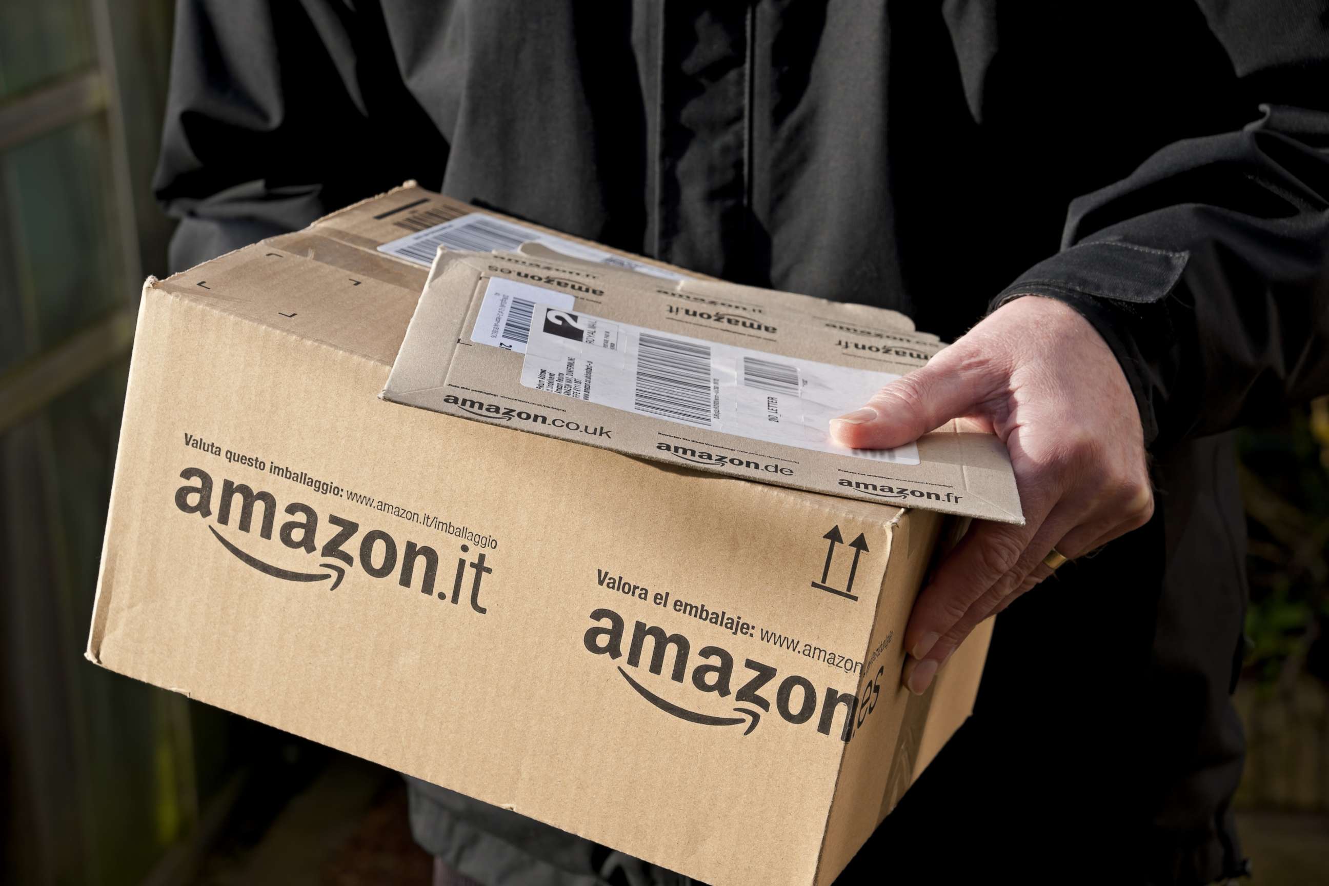 PHOTO: A man holding an Amazon delivery, Feb. 4, 2013, in this file photo.