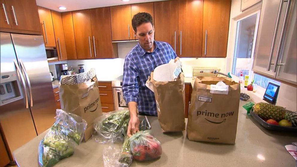 PHOTO: Steve Enders unpacks produce from an Amazon Prime Now grocery delivery order for "GMA." 