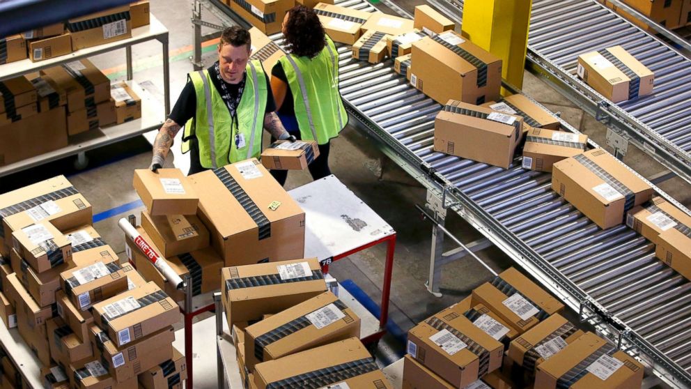 PHOTO: Amazon.com employees organize outbound packages at an Amazon.com Fulfillment Center on "Cyber Monday" the busiest online shopping day of the holiday season, in Phoenix, Dec. 2, 2013. 