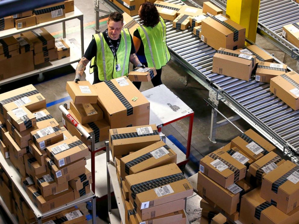 PHOTO: Amazon.com employees organize outbound packages at an Amazon.com Fulfillment Center on Cyber Monday the busiest online shopping day of the holiday season, in Phoenix, Dec. 2, 2013.