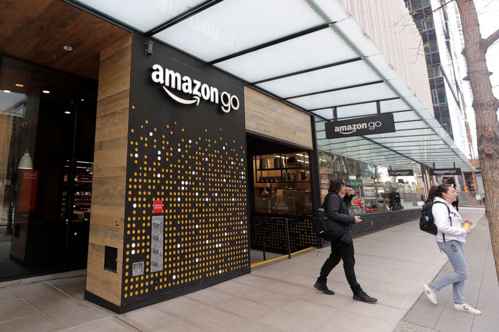 PHOTO: People walk out of an Amazon Go store in Seattle on March 4, 2020. An Amazon spokesperson said an employee who worked in a building on the company's campus in Seattle had tested positive for the novel coronavirus.