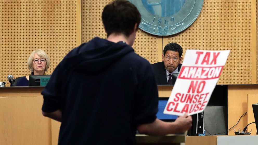 PHOTO: A man testifies at a Seattle City Council meeting where the council was expected to vote on a "head tax," May 14, 2018, in Seattle.