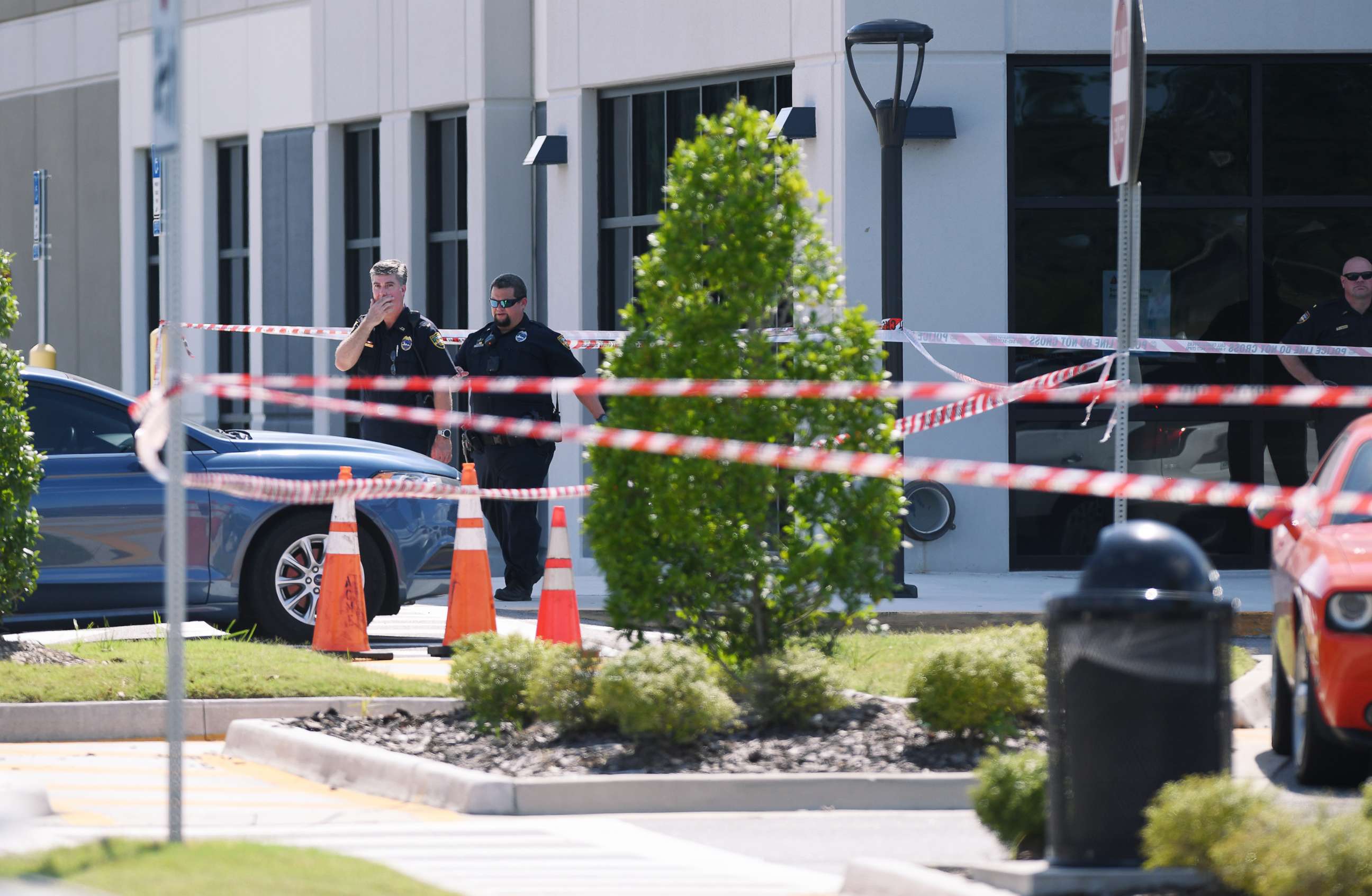 PHOTO: Crime scene tape is seen at the corner of the Amazon fulfillment center as law enforcement responds to a report of a shooting in Jacksonville, Fla., June 29, 2020.