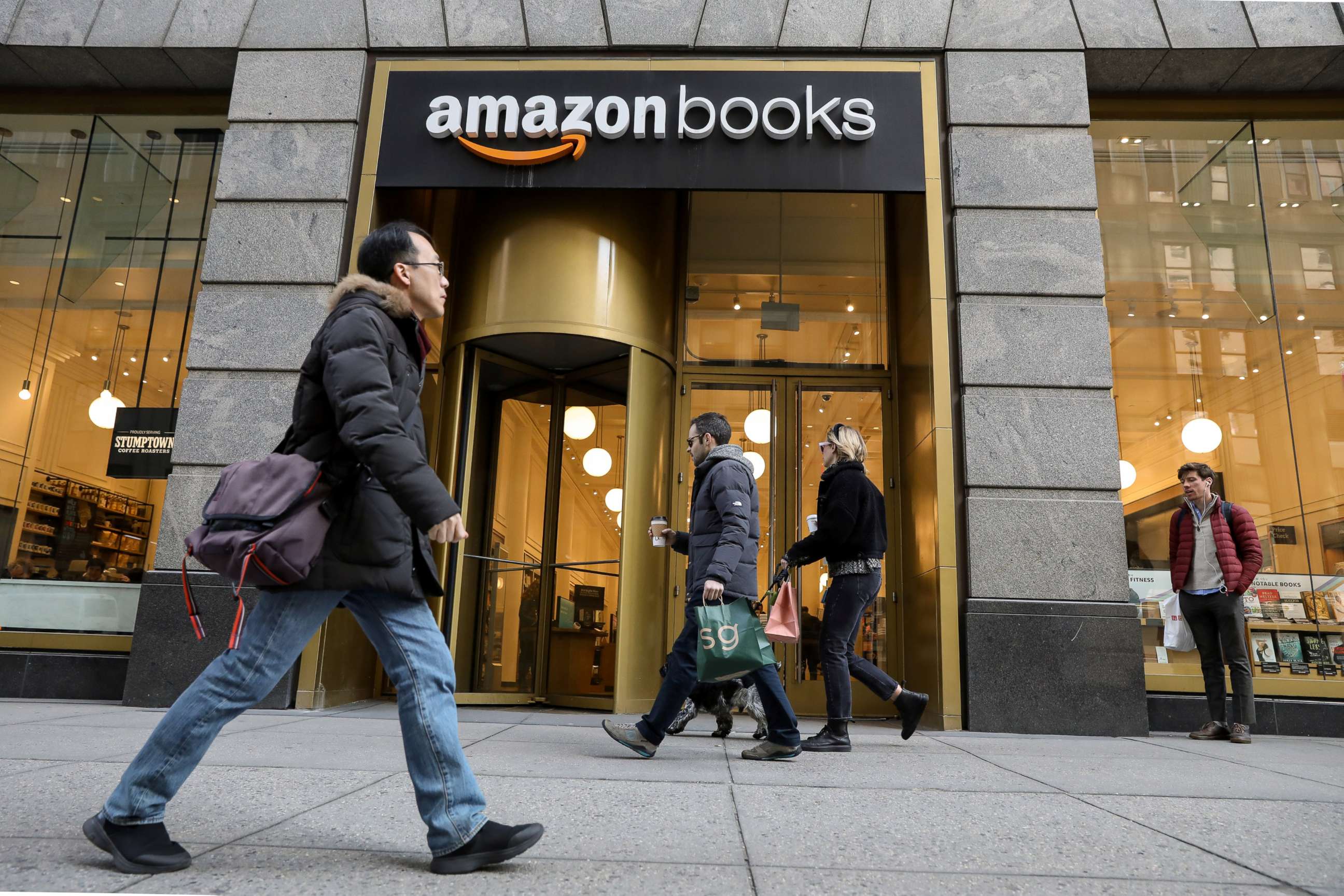 PHOTO: People walk past an Amazon Books retail store in New York, Feb.14, 2019.