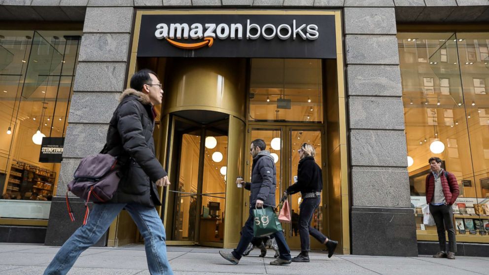 PHOTO: People walk past an Amazon Books retail store in New York, Feb.14, 2019.