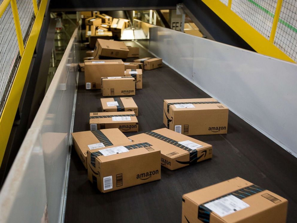 PHOTO: The boxes move along a treadmill at a processing center of Amazon.com Inc. in New Jersey on November 30, 2015.