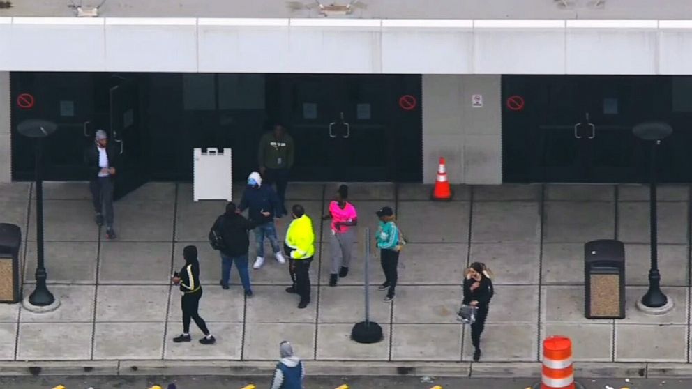 PHOTO: People walk out of the Amazon fulfillment center in Staten Island, New York, March 30, 2020.